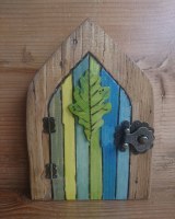 Pyrographed oak leaf door in greens