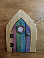 Fairy door with floral wreath in colour washed stripes